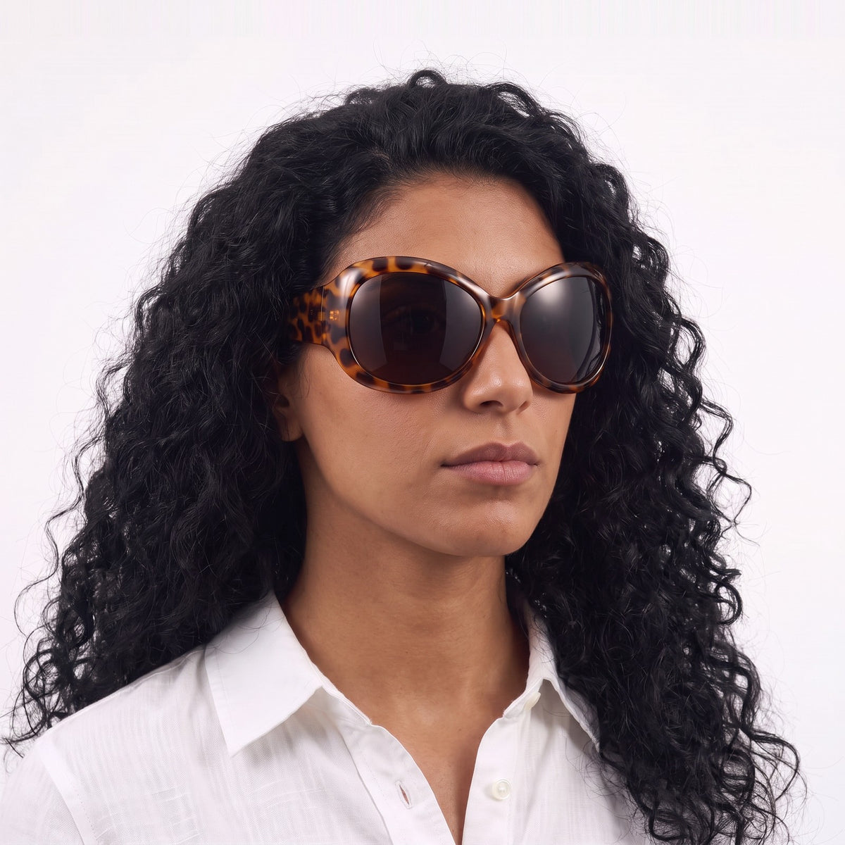 Woman in a white linen shirt wearing Barcelona bug-eye sunglasses with leopard print frame and brown lenses — Velezeco #opt1_6