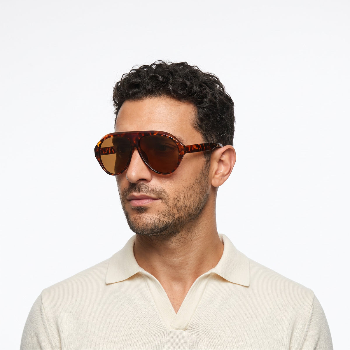 Man in a cream knit polo wearing Boston leopard oversized aviator sunglasses with brown lenses · Velezeco #opt1_2
