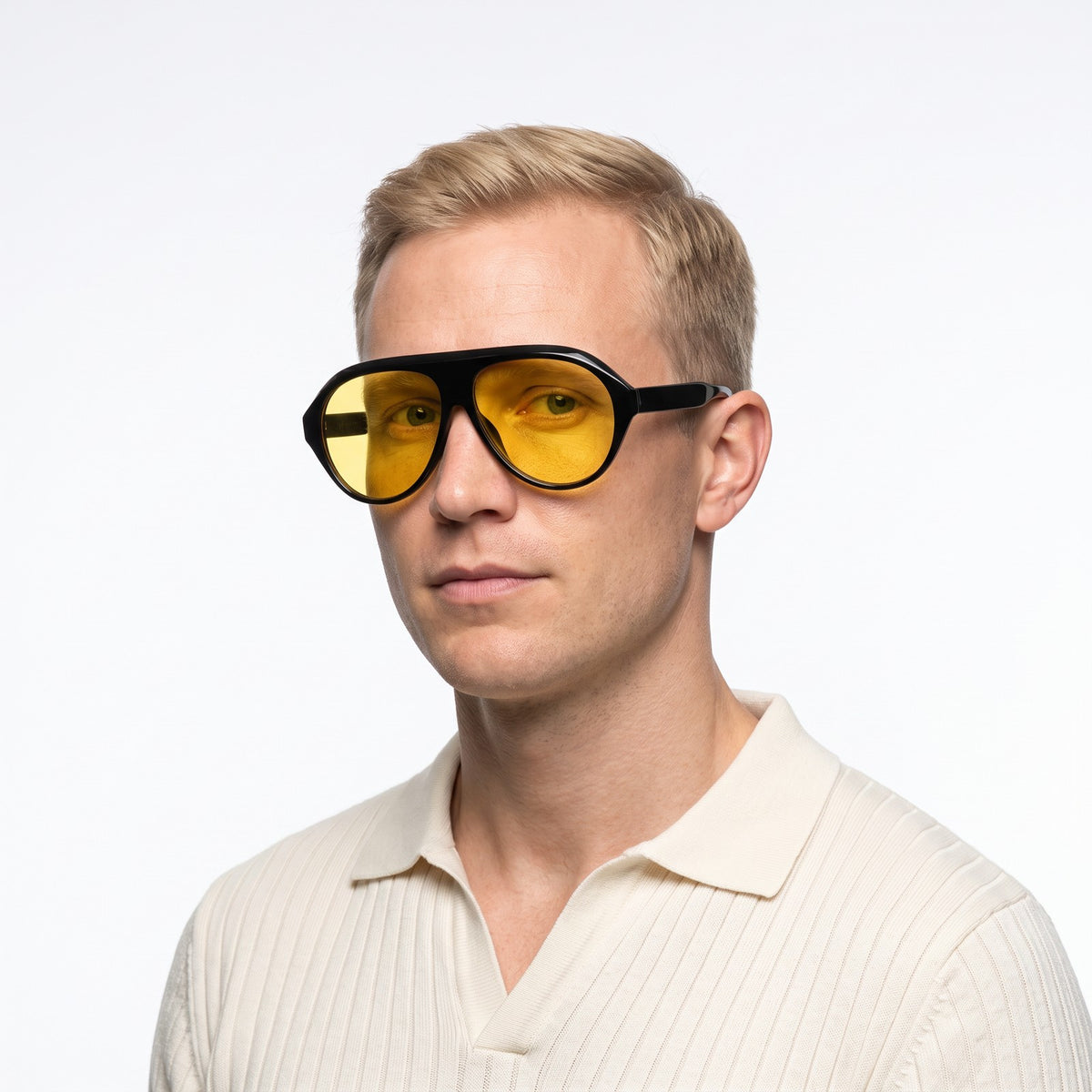 Man in a cream knit polo wearing Boston black oversized aviator sunglasses with yellow lenses · Velezeco #opt1_3