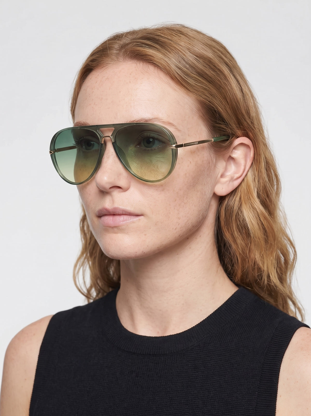 Model wearing Elysia aviator sunglasses in Green with green gradient lenses — Velezeco #opt1_1