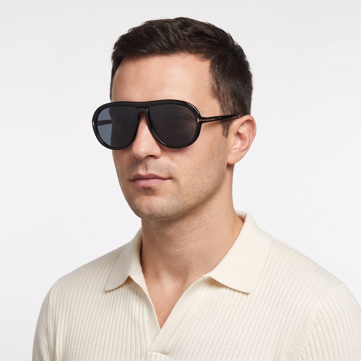 Man in a cream knit polo wearing Marbella black aviator sunglasses with black lenses · Velezeco #opt1_3