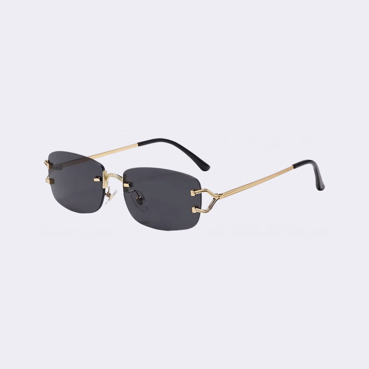 Three-quarter view of the rimless Moritz with gold metal details and black lenses showing the sculpted gold hinge — Velezeco #opt1_1