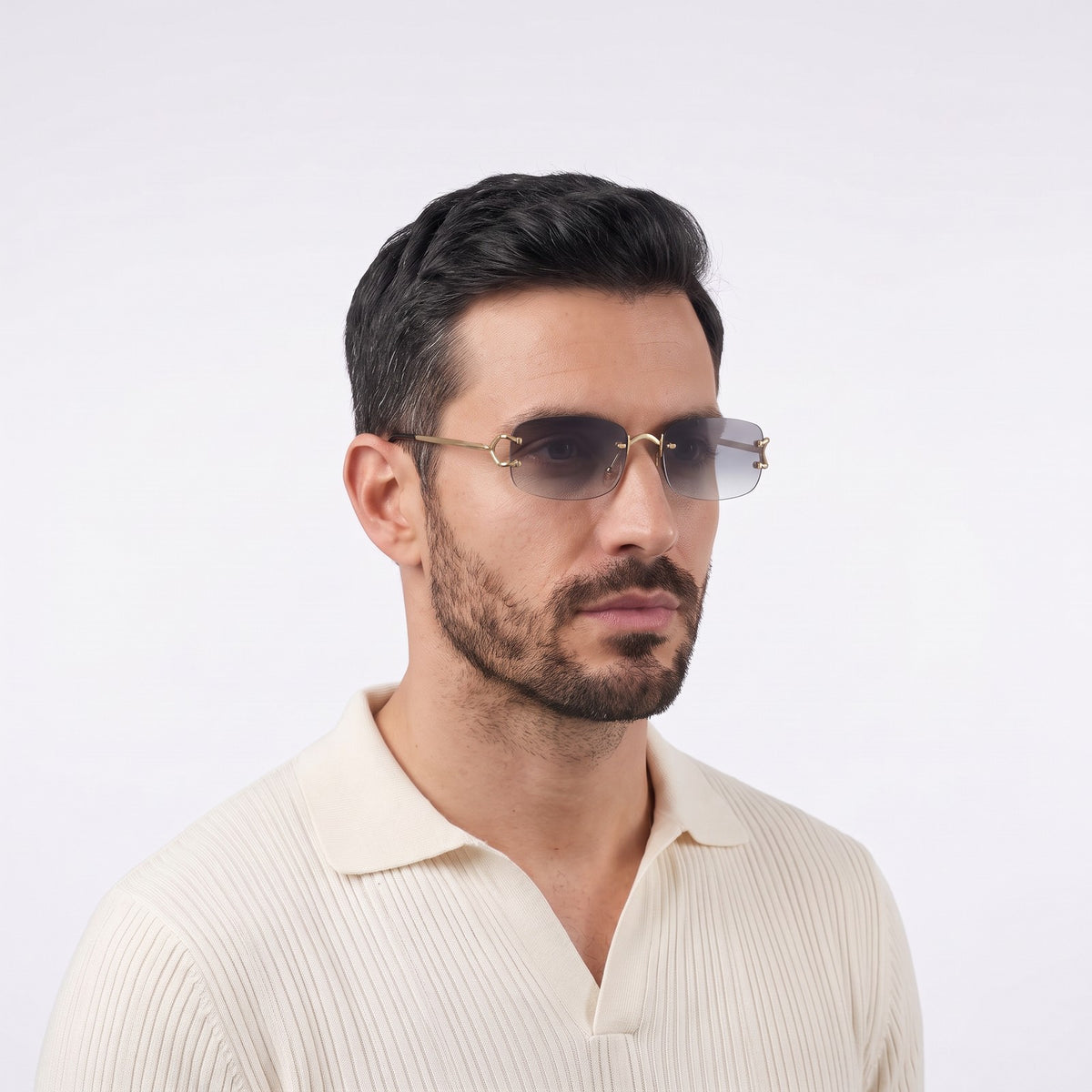 Man in a cream knit polo wearing Moritz rimless sunglasses with gold metal details and gradient grey lenses — Velezeco #opt1_3