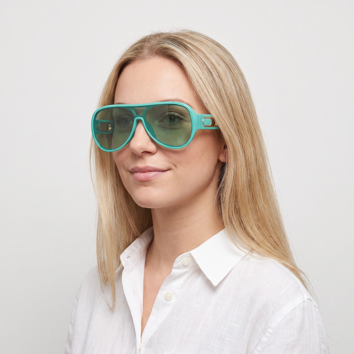 Woman in a white linen shirt wearing Portofino shield sunglasses with aqua turquoise frame and green lens — Velezeco #opt1_2