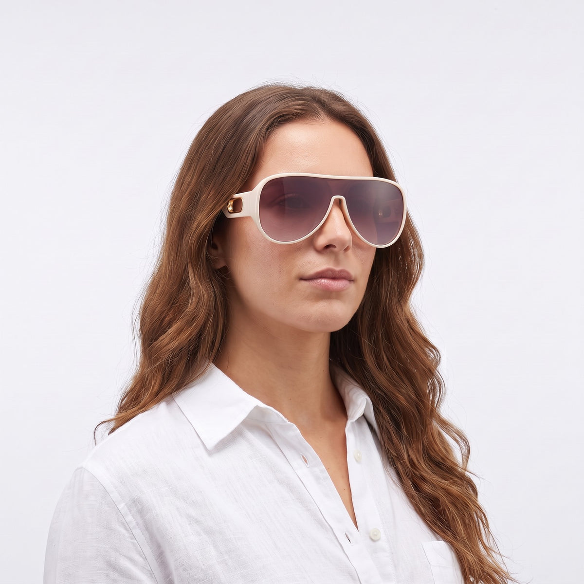 Woman in a white linen shirt wearing Portofino shield sunglasses with cream frame and purple gradient lens — Velezeco #opt1_3