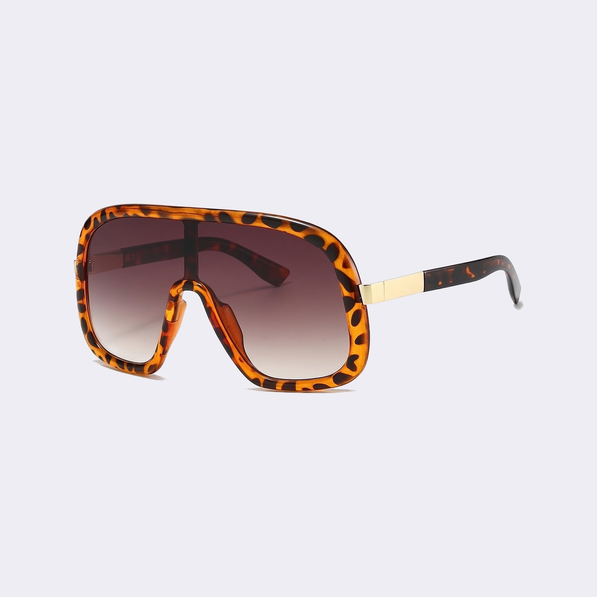 Three-quarter view of the leopard print frame and gradient brown lens showing the gold hinge detail — Saint-Tropez — Velezeco #opt1_3