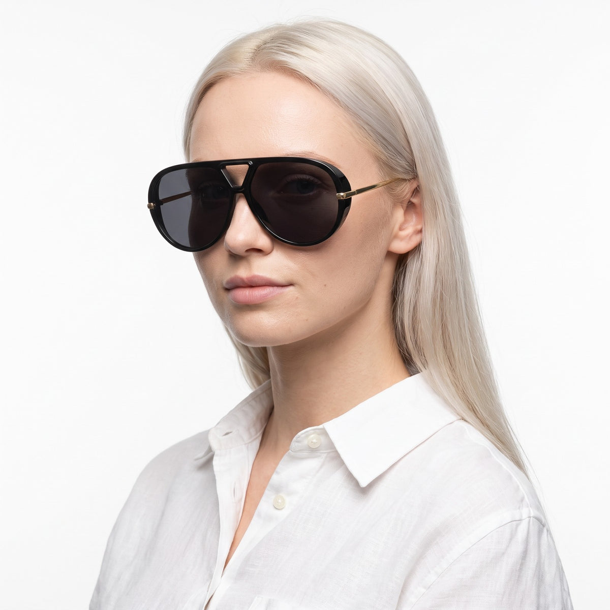 Woman in a white linen shirt wearing The Aether black aviator sunglasses with black lenses · Velezeco #opt1_3