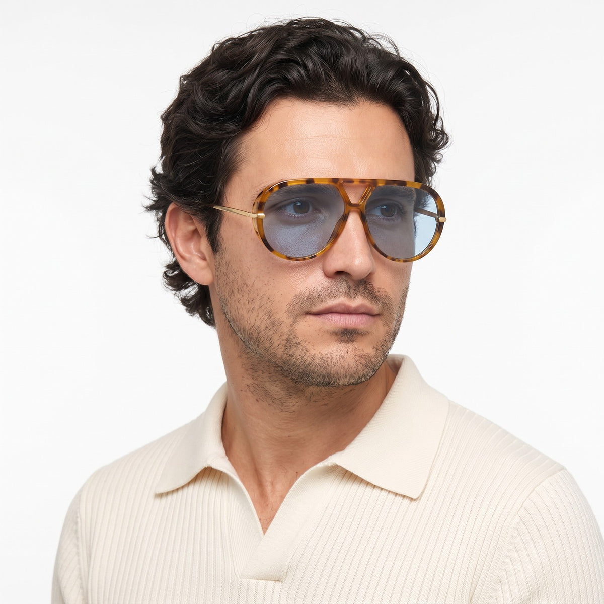 Man in a cream knit polo wearing The Aether havana aviator sunglasses with blue lenses · Velezeco #opt1_5