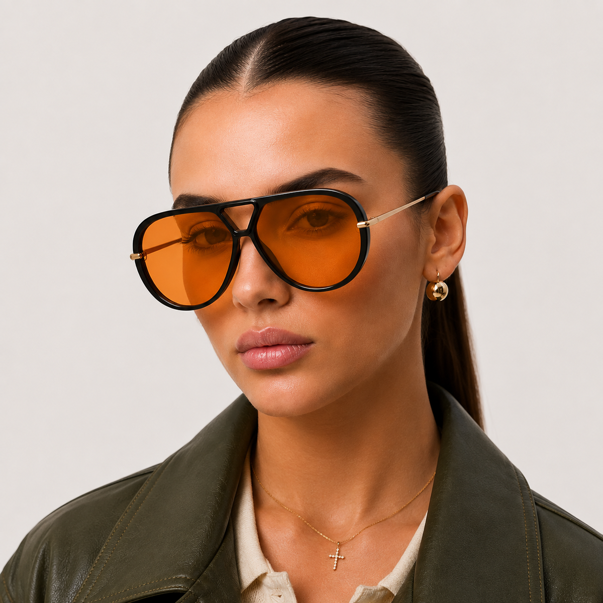 Woman wearing black aviator sunglasses with orange lenses, front view — The Nimbus — Velezeco — Black/Orange#opt1_3