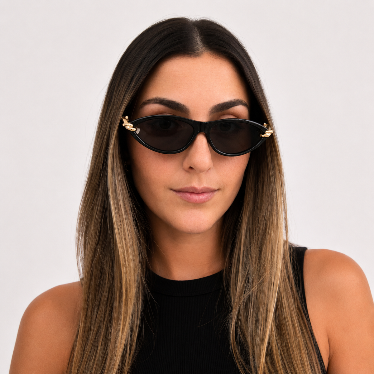 Woman wearing VELEZECO Santorini black cat-eye sunglasses with dark lenses and gold details — Black#opt1_2