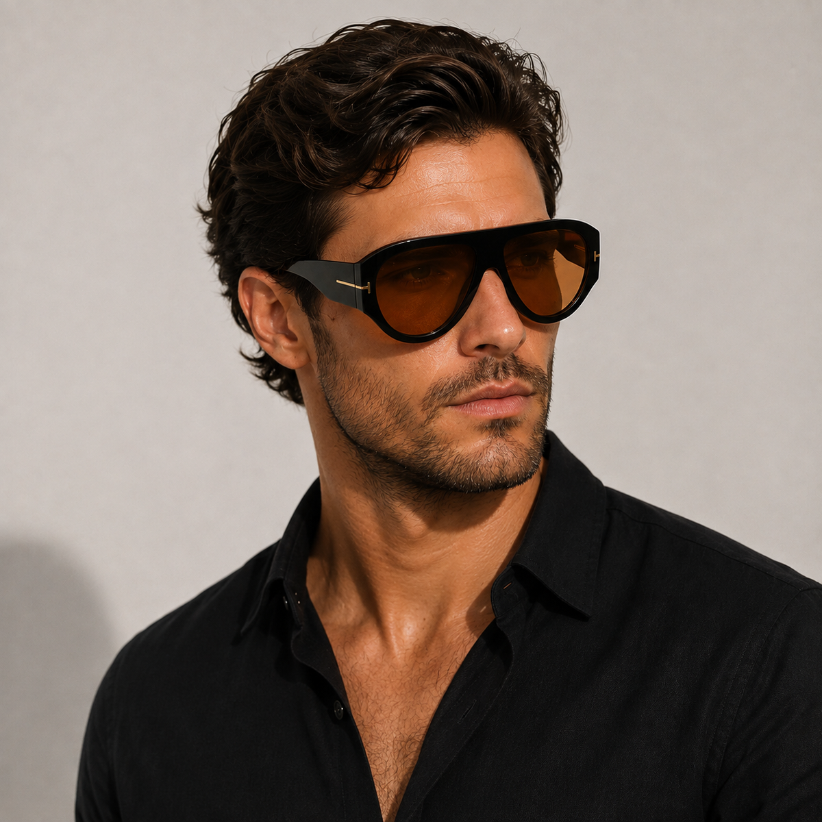 Man wearing VELEZECO Veneza black oversized aviator sunglasses with brown lenses and gold details #opt1_1