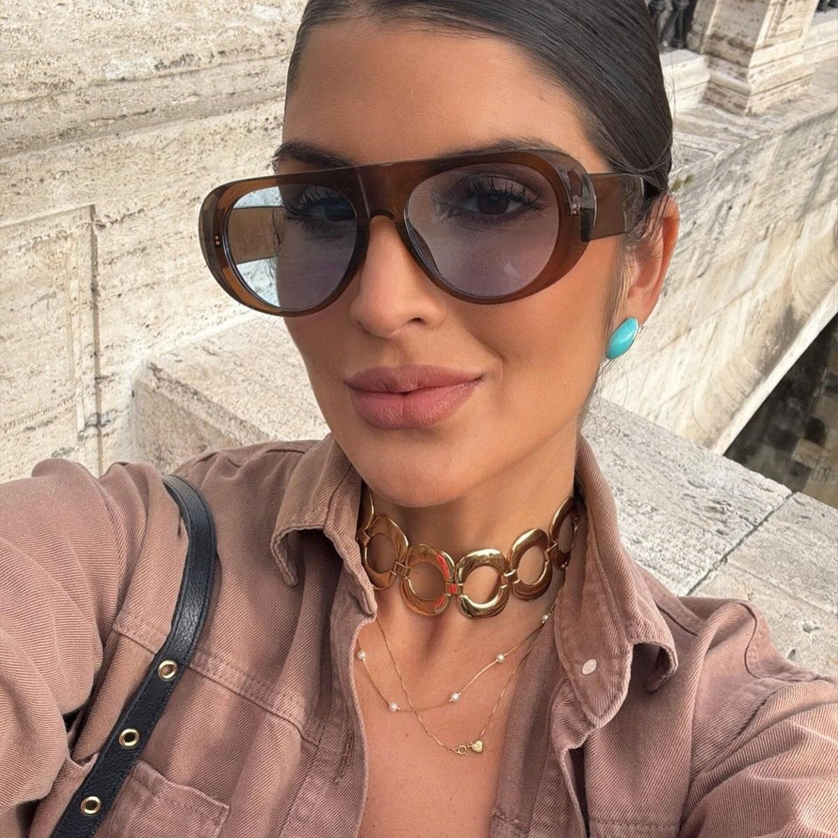 Oversized aviator sunglasses worn in the street