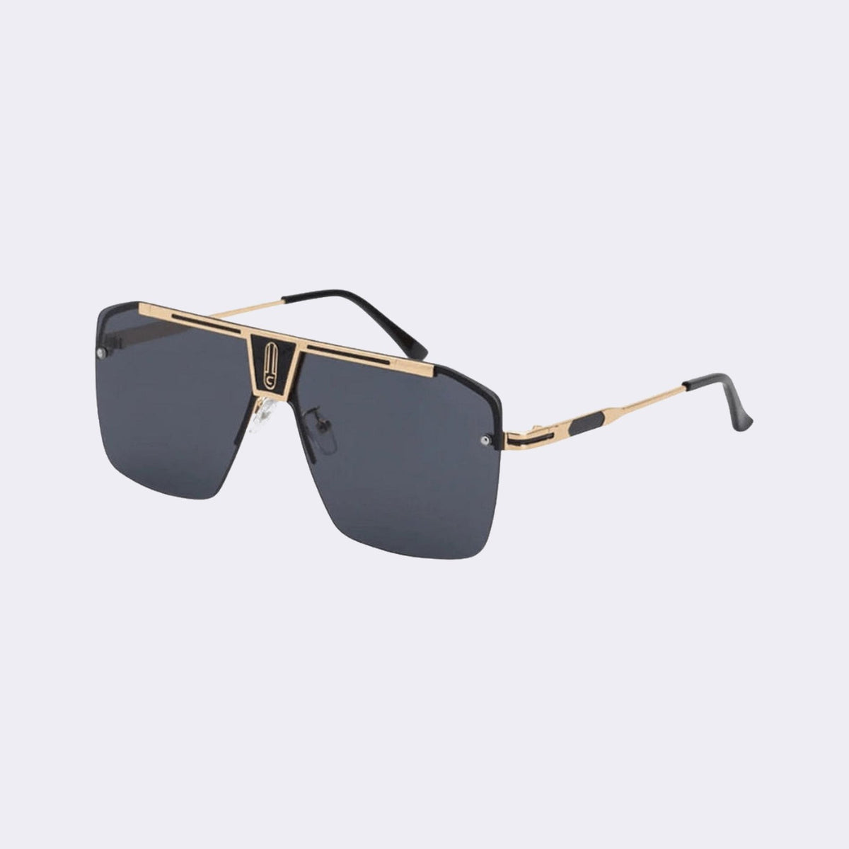 Three-quarter view of the Alpine shield with a gold frame and dark smoke grey lens — Velezeco #opt1_2