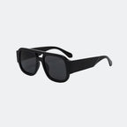 Oversized sunglasses lens close-up detail — Crimson — Velezeco