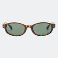 Round sunglasses worn by model outdoors — Kessie — Velezeco