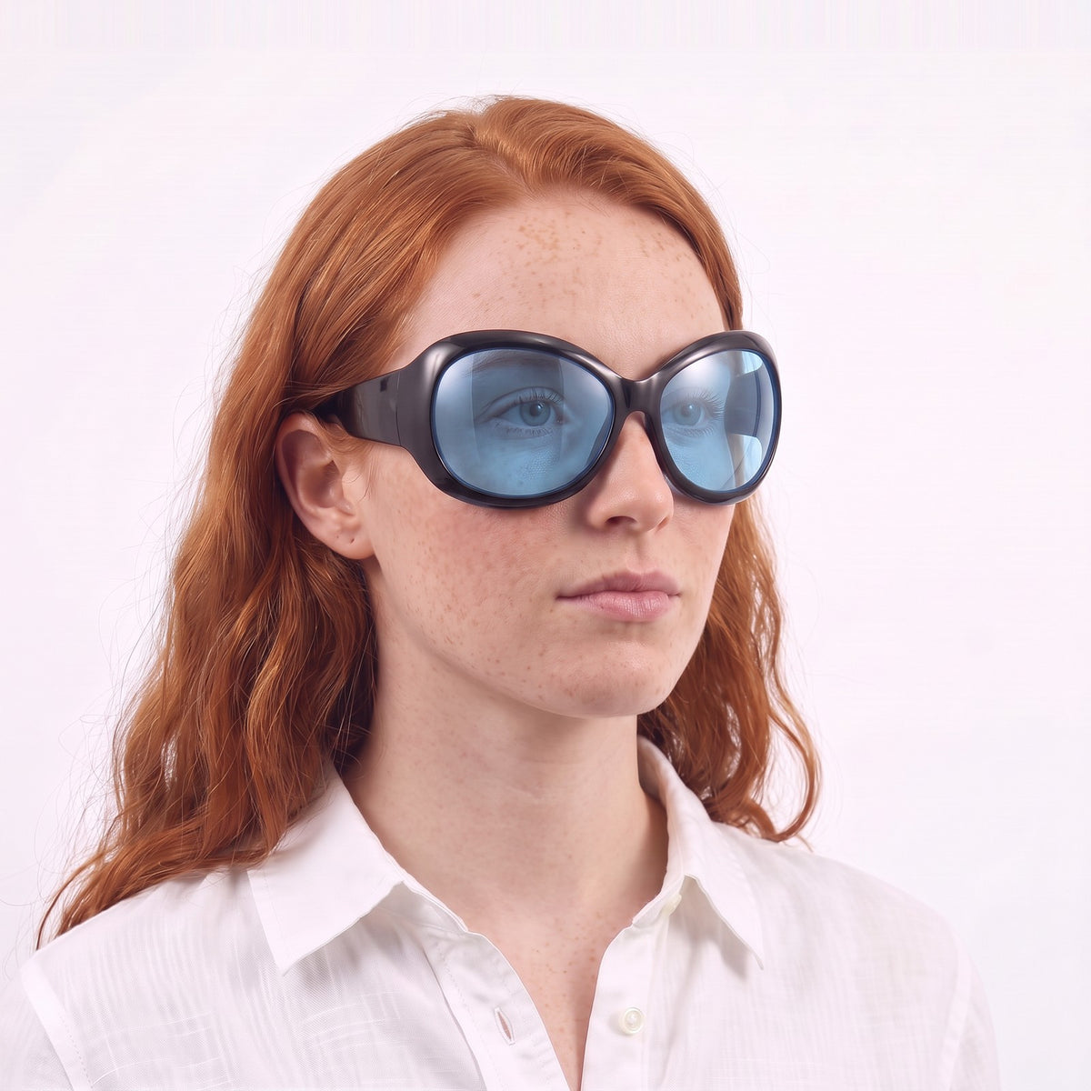 Woman in a white linen shirt wearing Barcelona bug-eye sunglasses with glossy black frame and blue lenses — Velezeco #opt1_5
