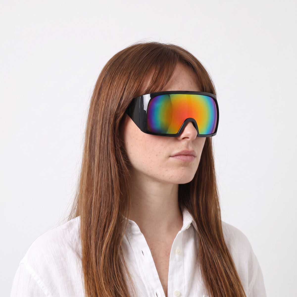 Woman in a white linen shirt wearing Berlin wrap shield sunglasses with glossy black frame and rainbow mirror lens — Velezeco #opt1_2