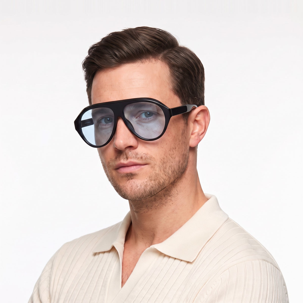 Man in a cream knit polo wearing Boston black oversized aviator sunglasses with light blue lenses · Velezeco #opt1_4