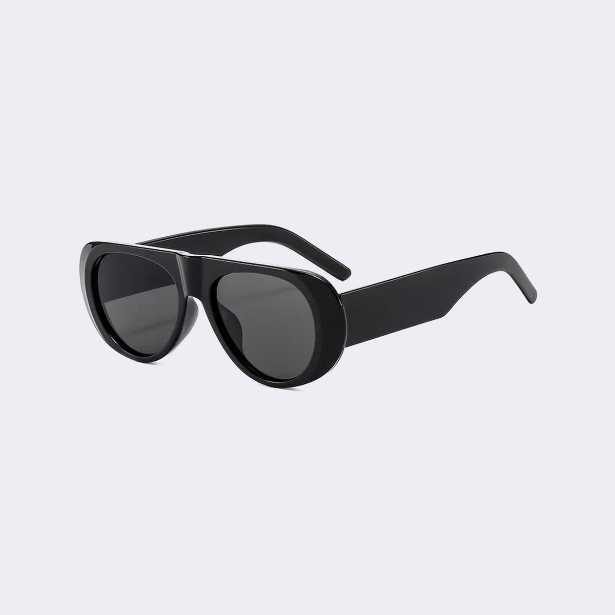 Three-quarter view of the Cortina with a black frame and grey lenses, showing the flared side shield — Velezeco #opt1_1