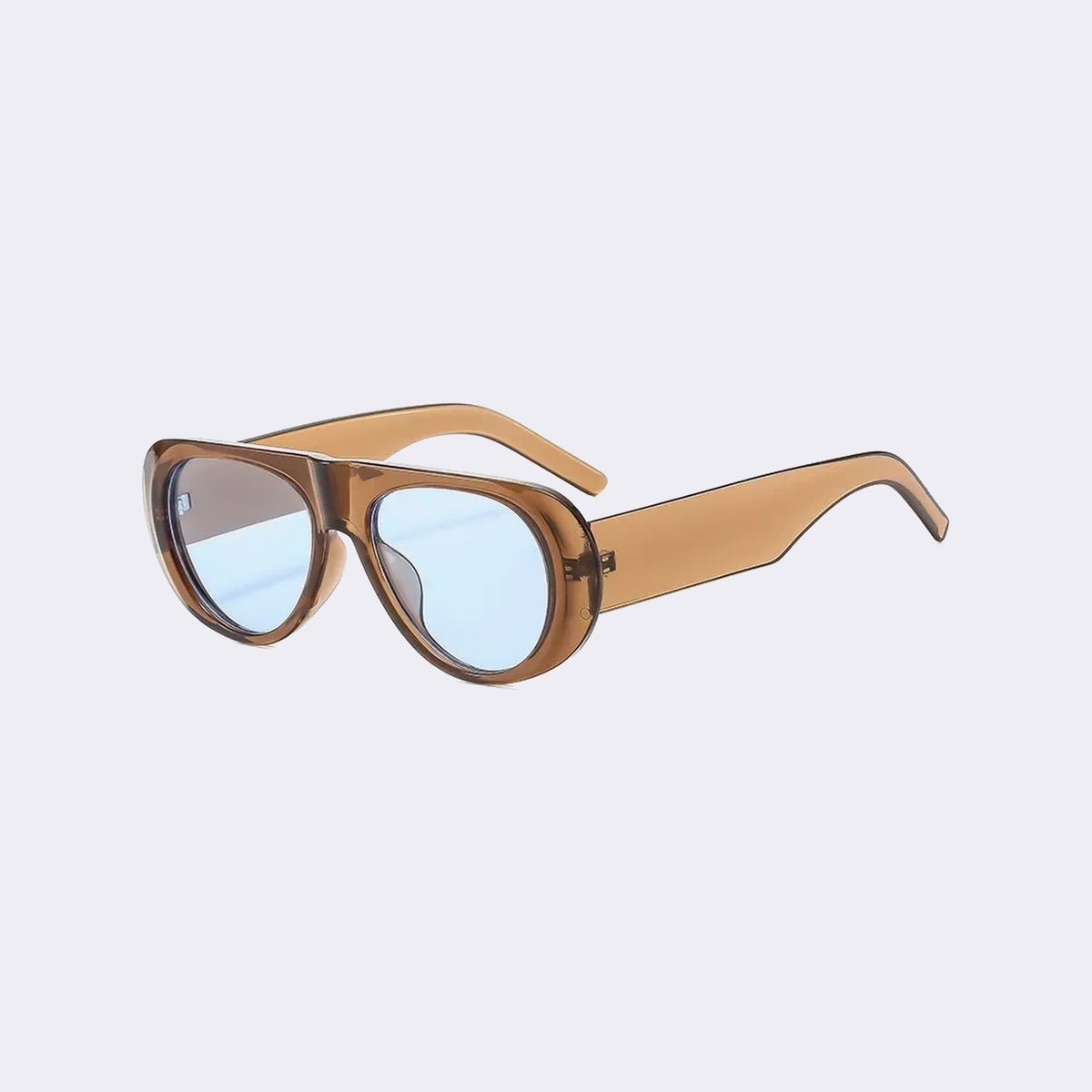 Three-quarter view of the Cortina with a translucent caramel frame and pale blue lenses, showing the flared side shield — Velezeco #opt1_5