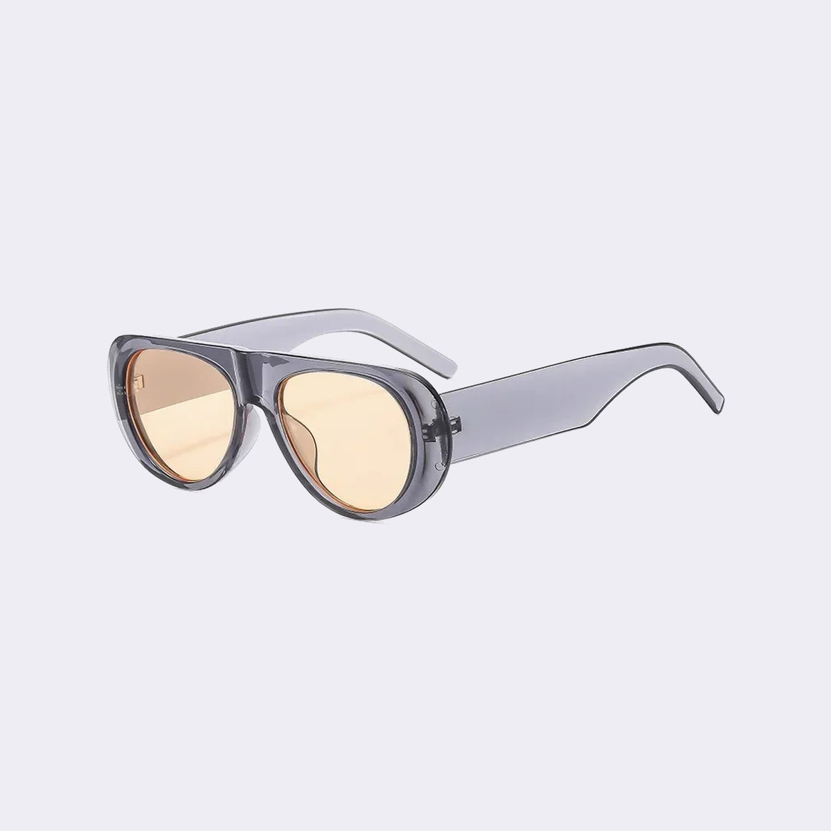Three-quarter view of the Cortina with a translucent grey frame and yellow lenses, showing the flared side shield — Velezeco #opt1_7