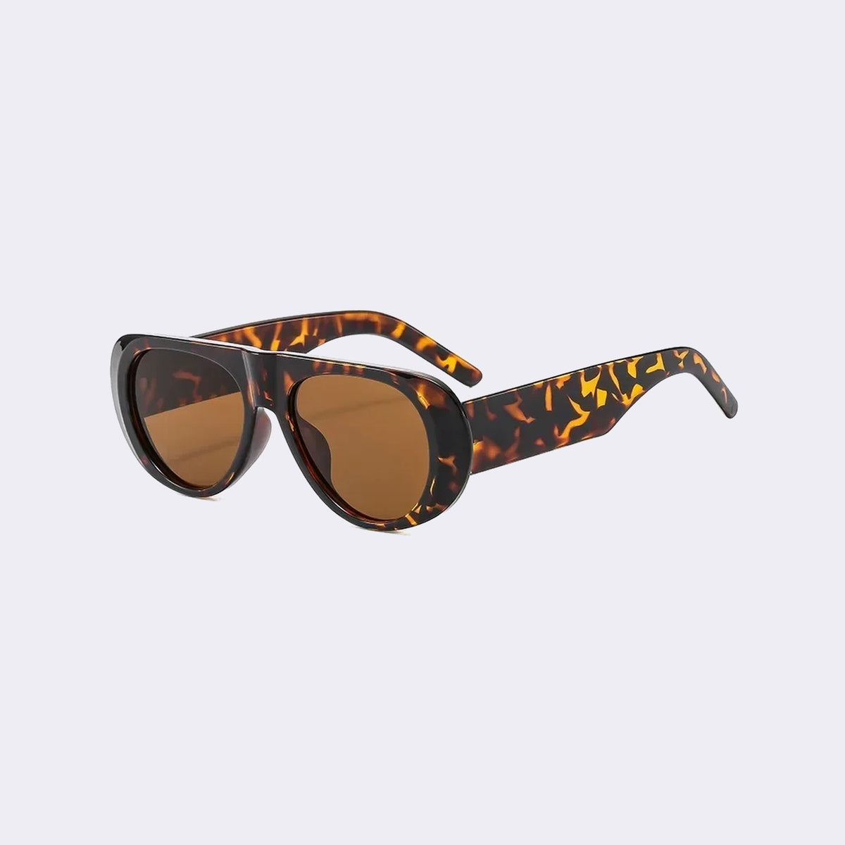 Three-quarter view of the Cortina with a tortoiseshell frame and brown lenses, showing the flared side shield — Velezeco #opt1_2