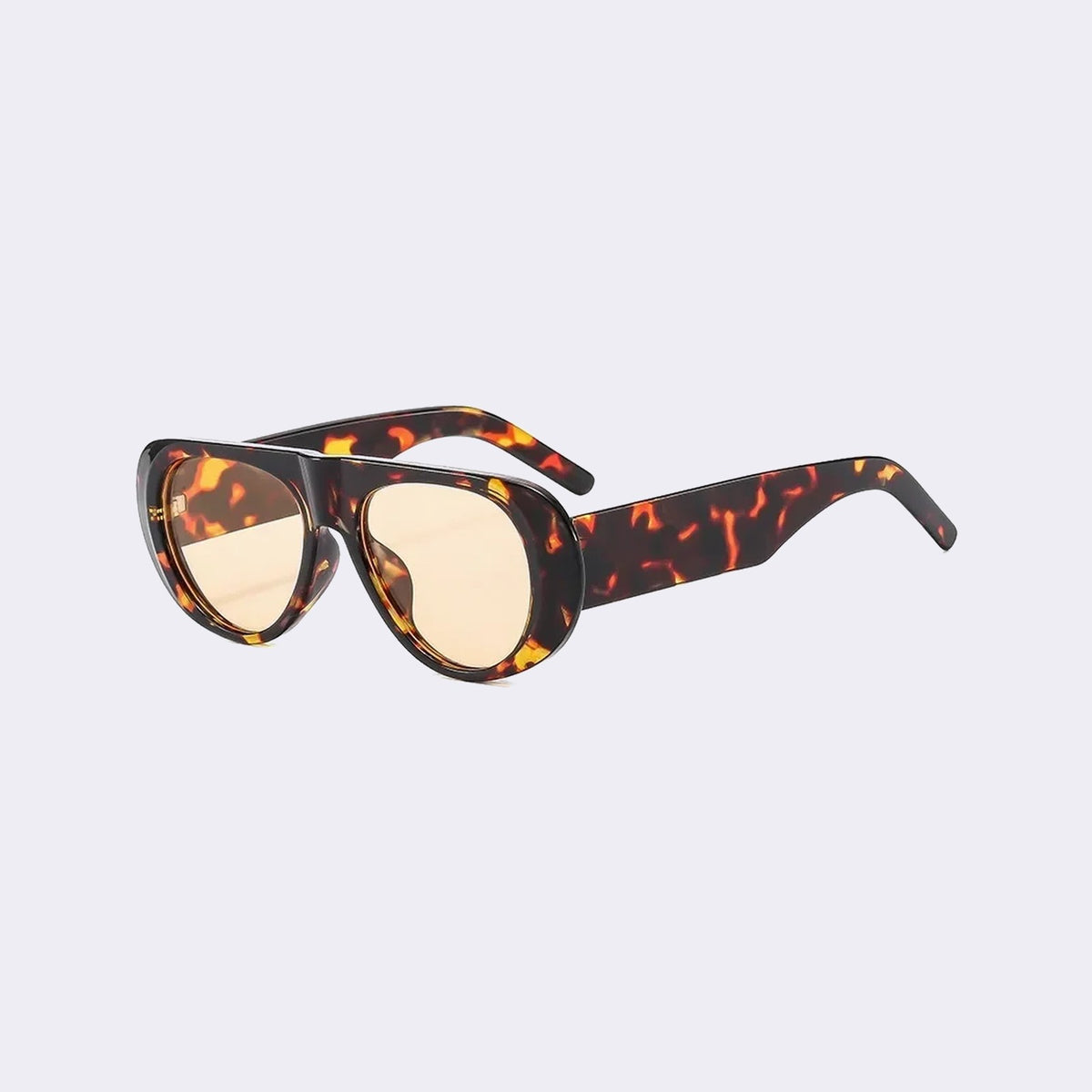 Three-quarter view of the Cortina with a tortoiseshell frame and yellow lenses, showing the flared side shield — Velezeco #opt1_4