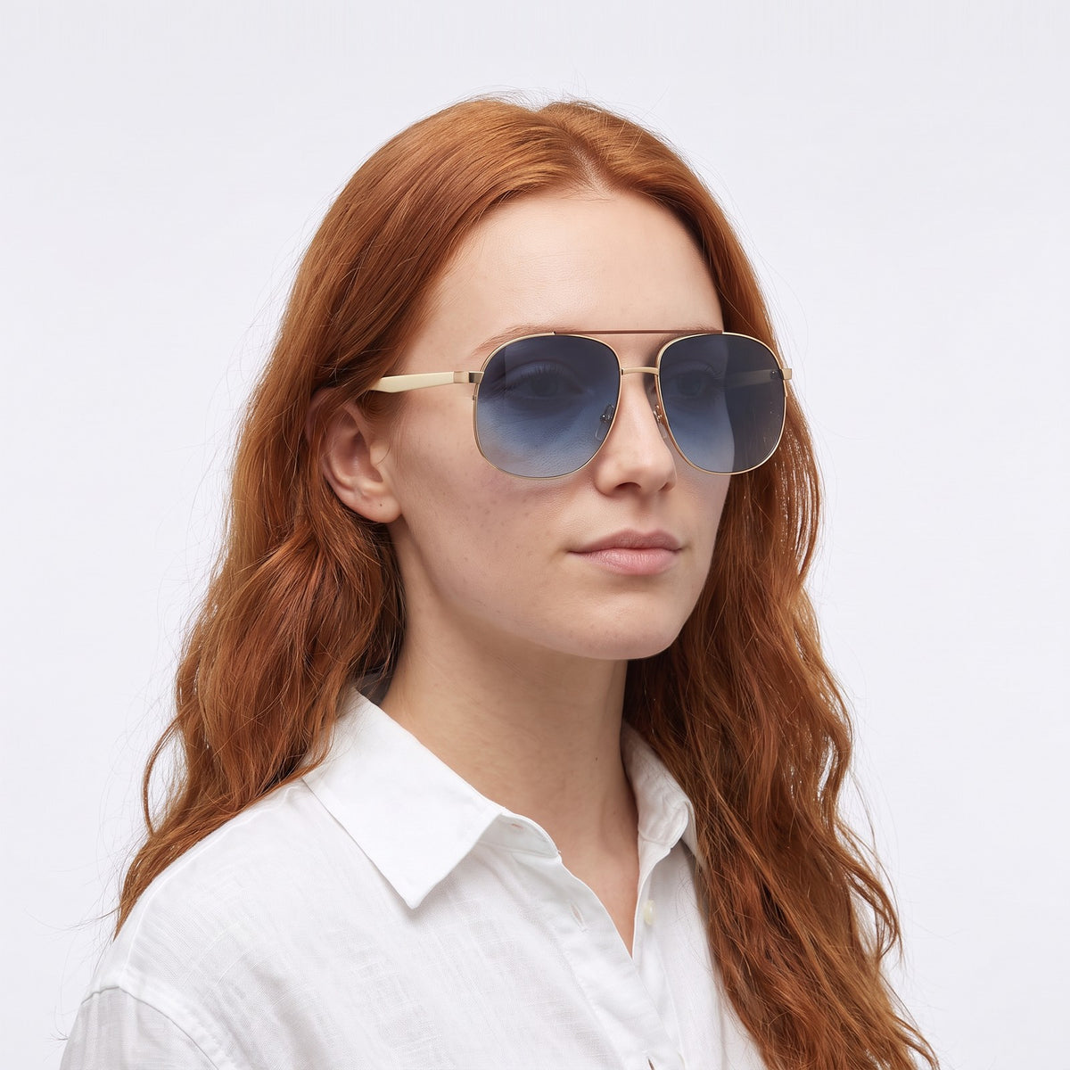 Woman in a white linen shirt wearing Dubai aviator sunglasses with gold double bridge and gradient blue lenses — Velezeco #opt1_5