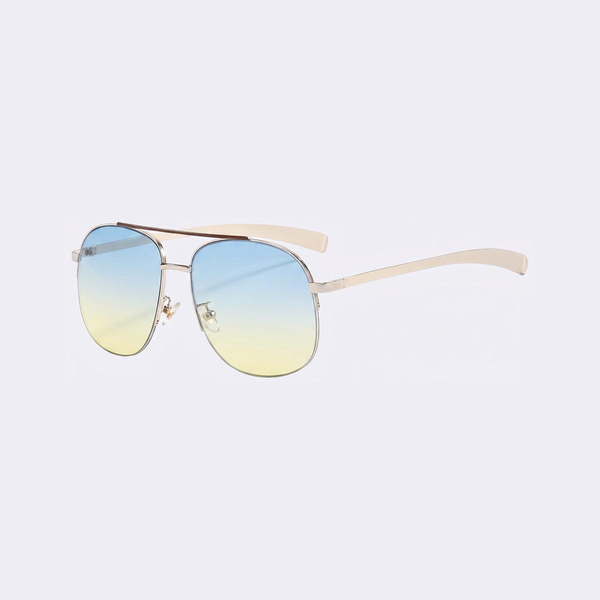 Three-quarter view of the Dubai aviator with silver double bridge and blue-to-yellow gradient lenses and cream temples — Velezeco #opt1_7