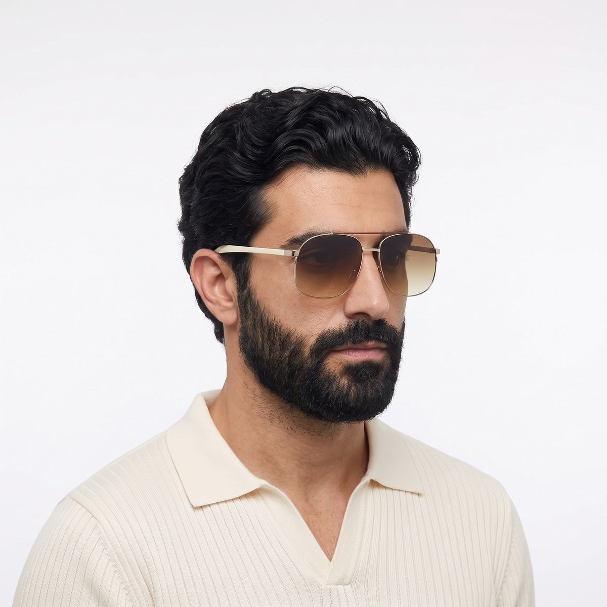Man in a cream knit polo wearing Dubai aviator sunglasses with gold double bridge and gradient brown lenses — Velezeco #opt1_6