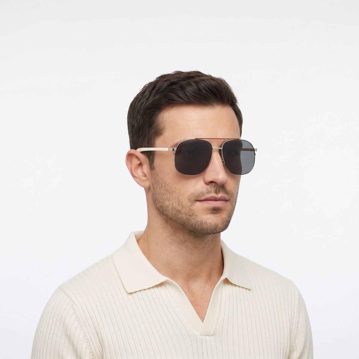 Man in a cream knit polo wearing Dubai aviator sunglasses with silver double bridge and dark grey lenses — Velezeco #opt1_1