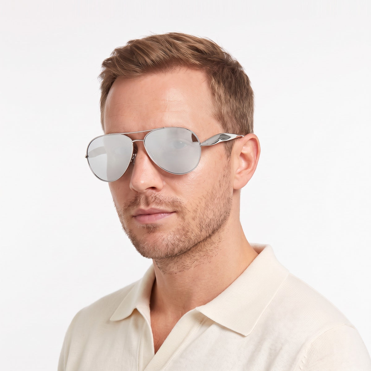 Man in a cream knit polo wearing Duna silver aviator sunglasses with silver mirror lenses · Velezeco #opt1_7