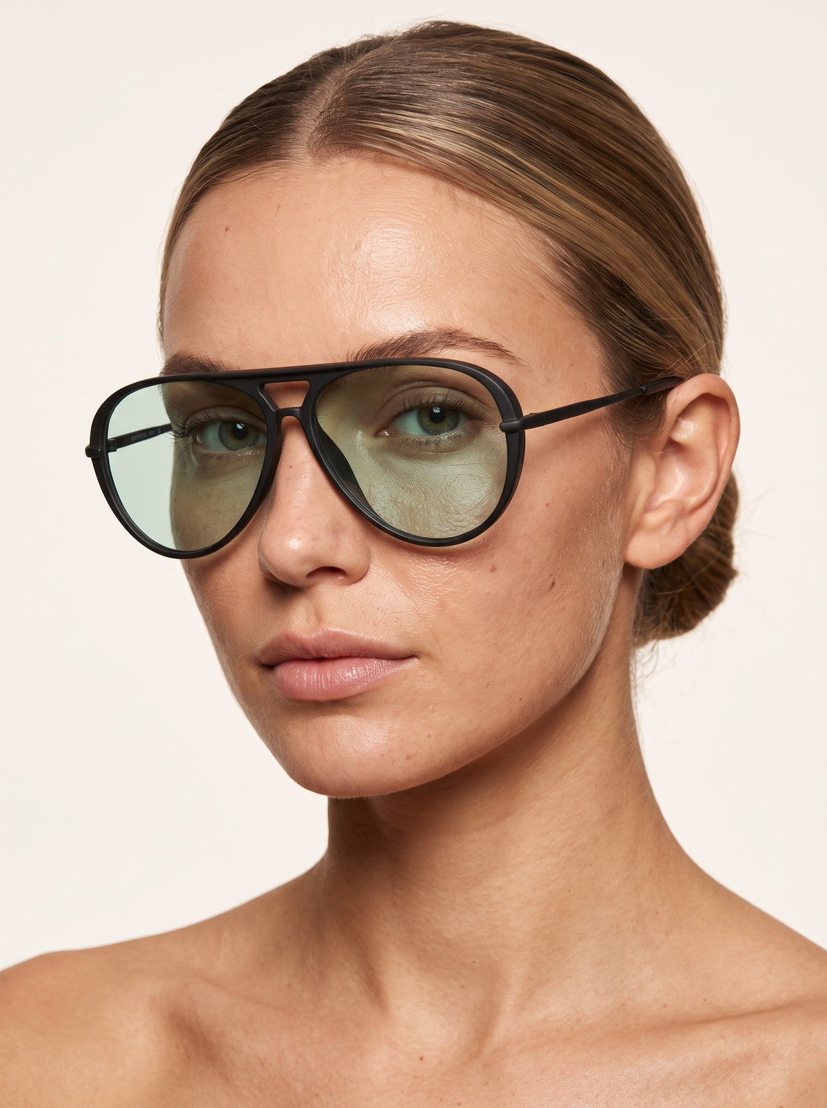 Model wearing Elysia aviator sunglasses in Black Green Lens with green lenses — Velezeco #opt1_3