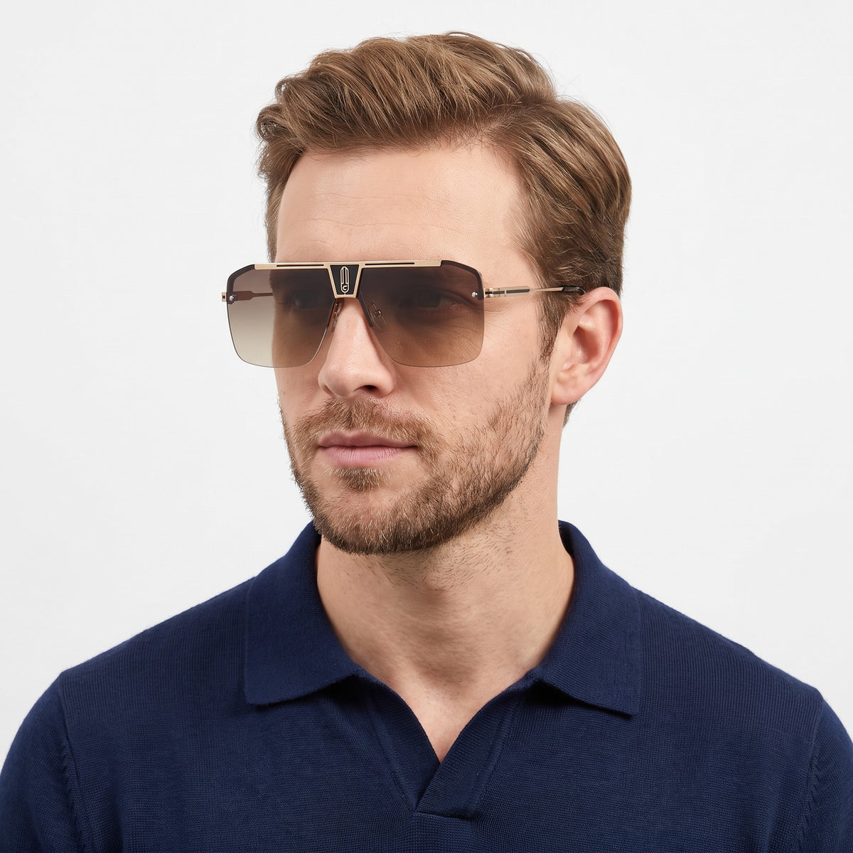 Man in a navy knit polo wearing Alpine shield sunglasses with a coffee beige gradient lens — Velezeco #opt1_4