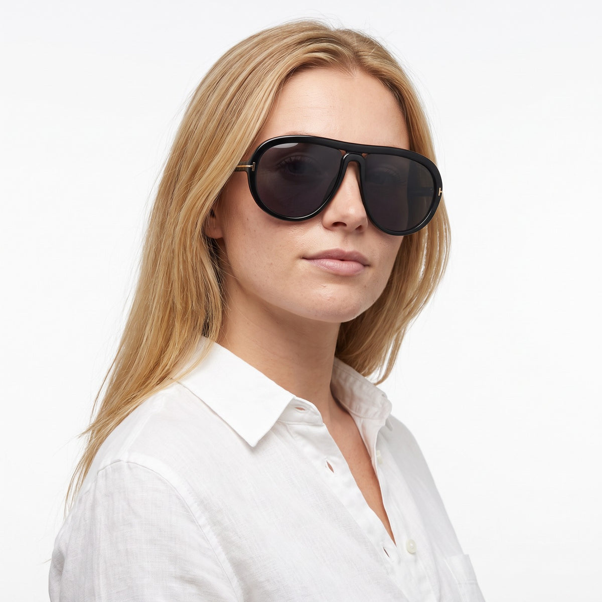 Woman in a white linen shirt wearing Marbella black aviator sunglasses with black lenses · Velezeco #opt1_3
