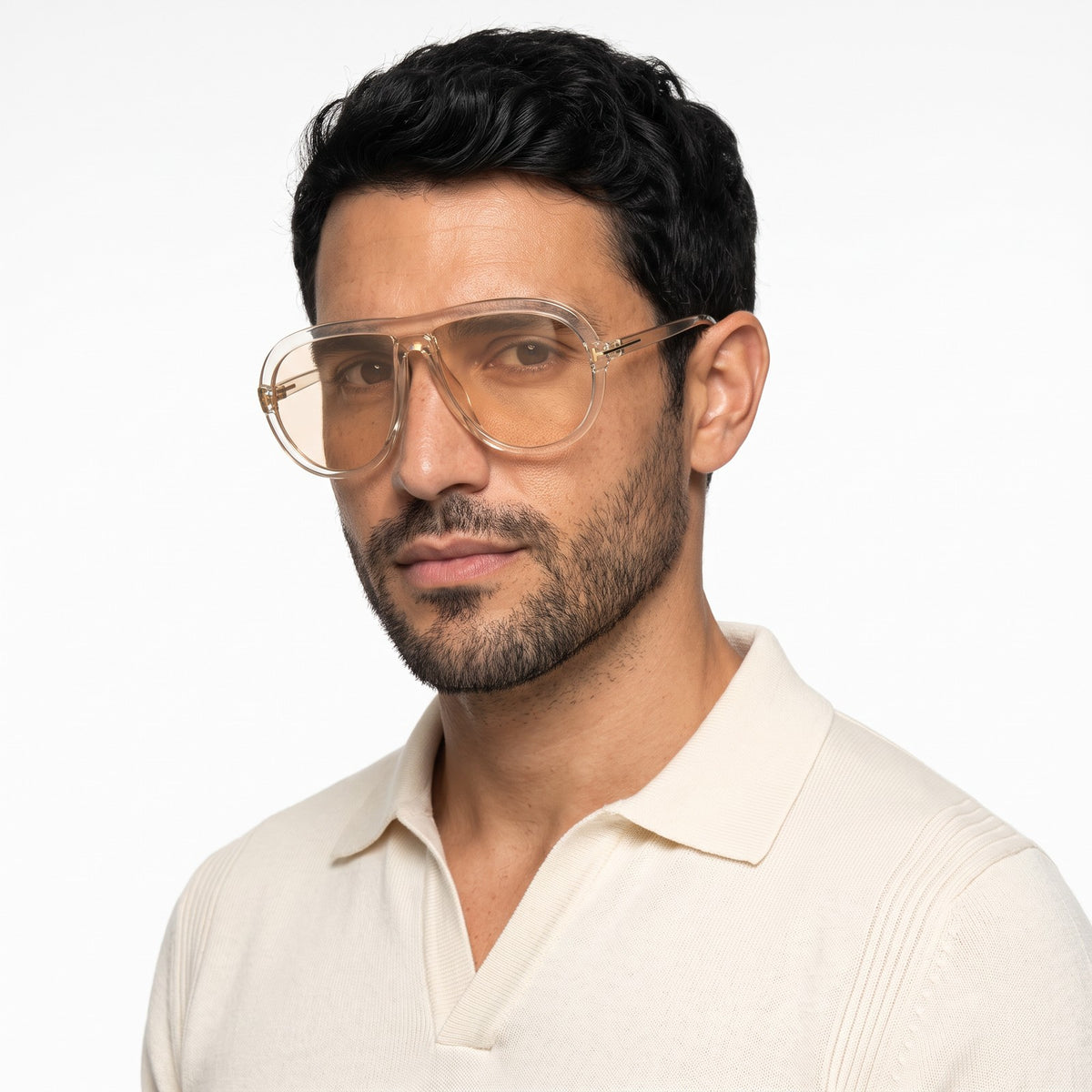 Man in a cream knit polo wearing Marbella transparent champagne aviator sunglasses with champagne lenses · Velezeco #opt1_2