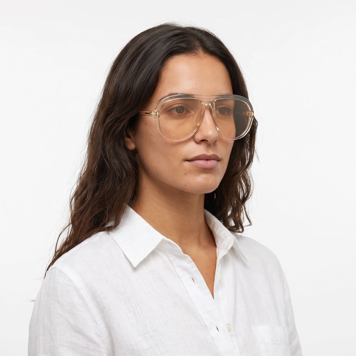 Woman in a white linen shirt wearing Marbella transparent champagne aviator sunglasses with champagne lenses · Velezeco #opt1_2