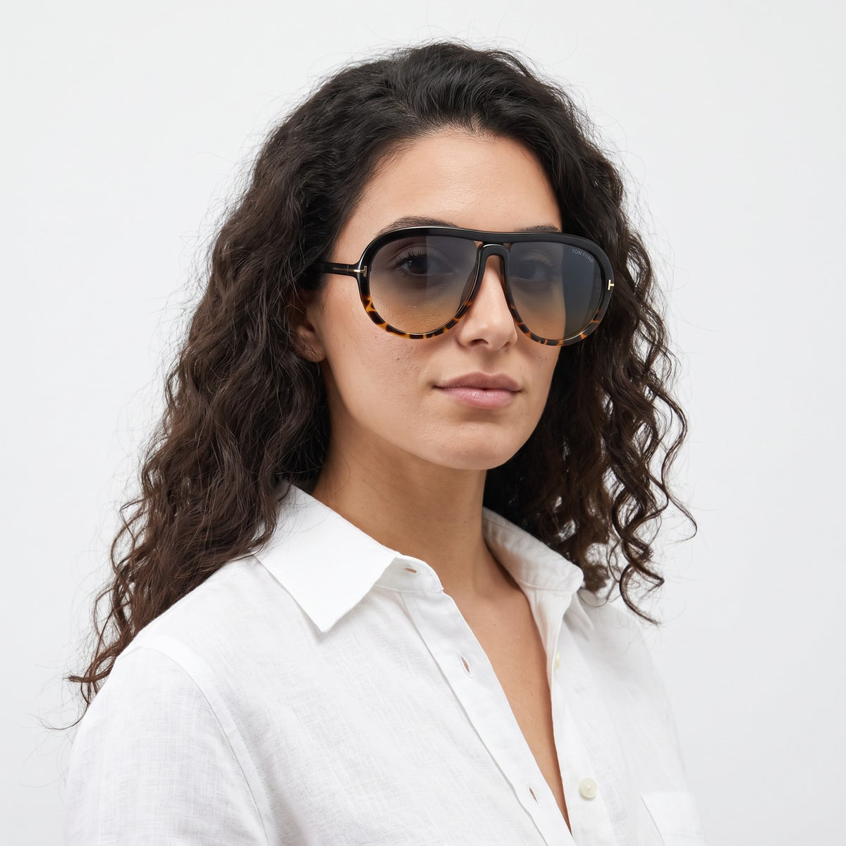 Woman in a white linen shirt wearing Marbella black and leopard aviator sunglasses with gradient lenses · Velezeco #opt1_5