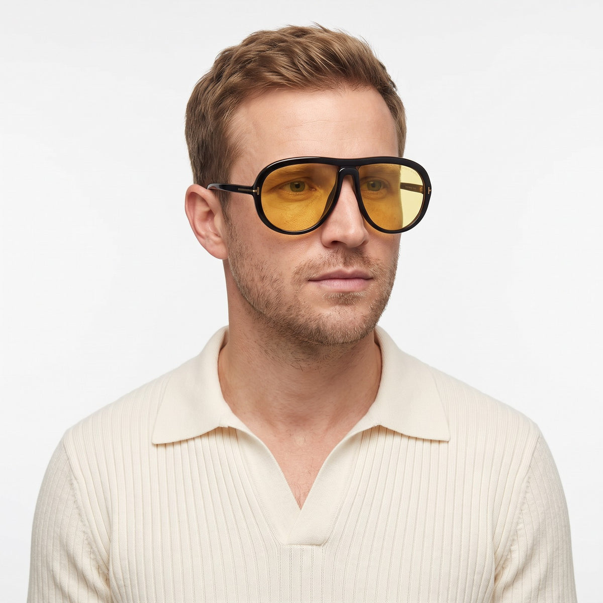 Man in a cream knit polo wearing Marbella black aviator sunglasses with yellow lenses · Velezeco #opt1_4