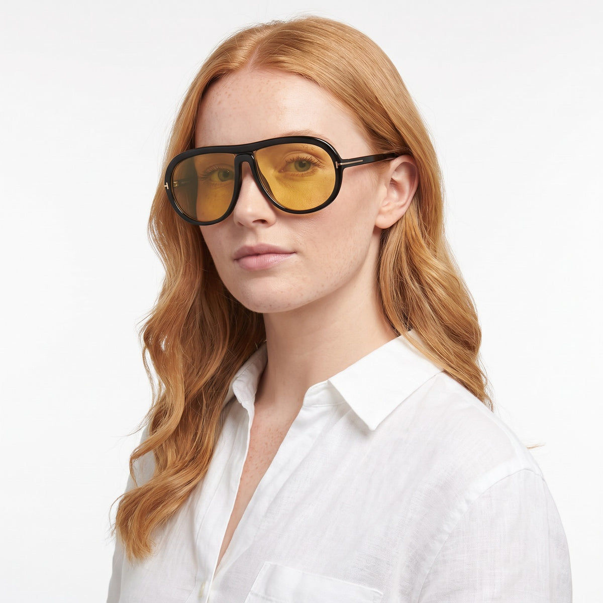 Woman in a white linen shirt wearing Marbella black aviator sunglasses with yellow lenses · Velezeco #opt1_4