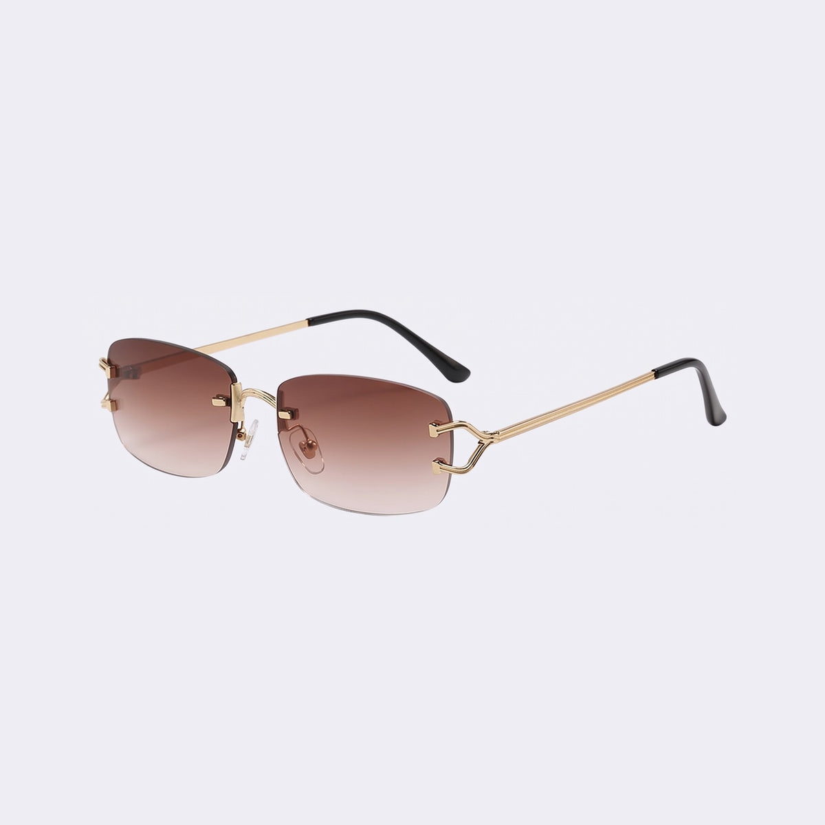 Three-quarter view of the rimless Moritz with gold metal details and gradient brown lenses showing the sculpted gold hinge — Velezeco #opt1_2