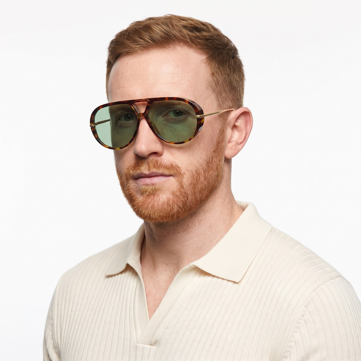 Man in a cream knit polo wearing The Aether havana aviator sunglasses with green lenses · Velezeco #opt1_4