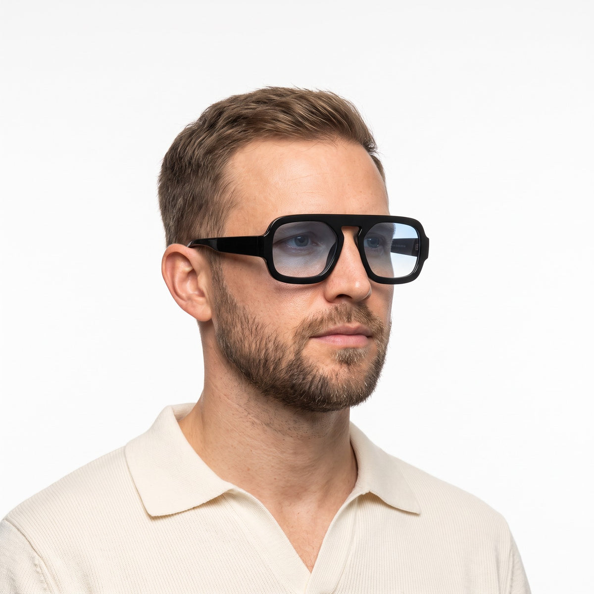 Man in a cream knit polo wearing Vortex black square pilot sunglasses with light blue gradient lenses · Velezeco #opt1_7
