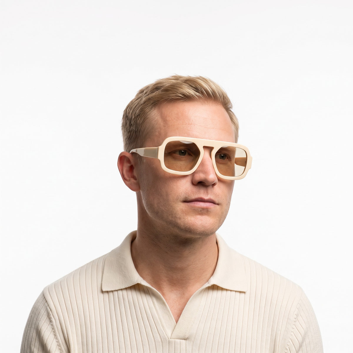 Man in a cream knit polo wearing Vortex cream square pilot sunglasses with beige lenses · Velezeco #opt1_4