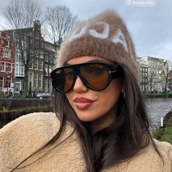 Oversized aviator sunglasses worn in the street